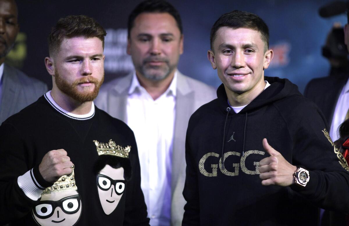 Canelo Alvarez, left, and Gennady Golovkin pose during their final news conference before Saturday's fight.