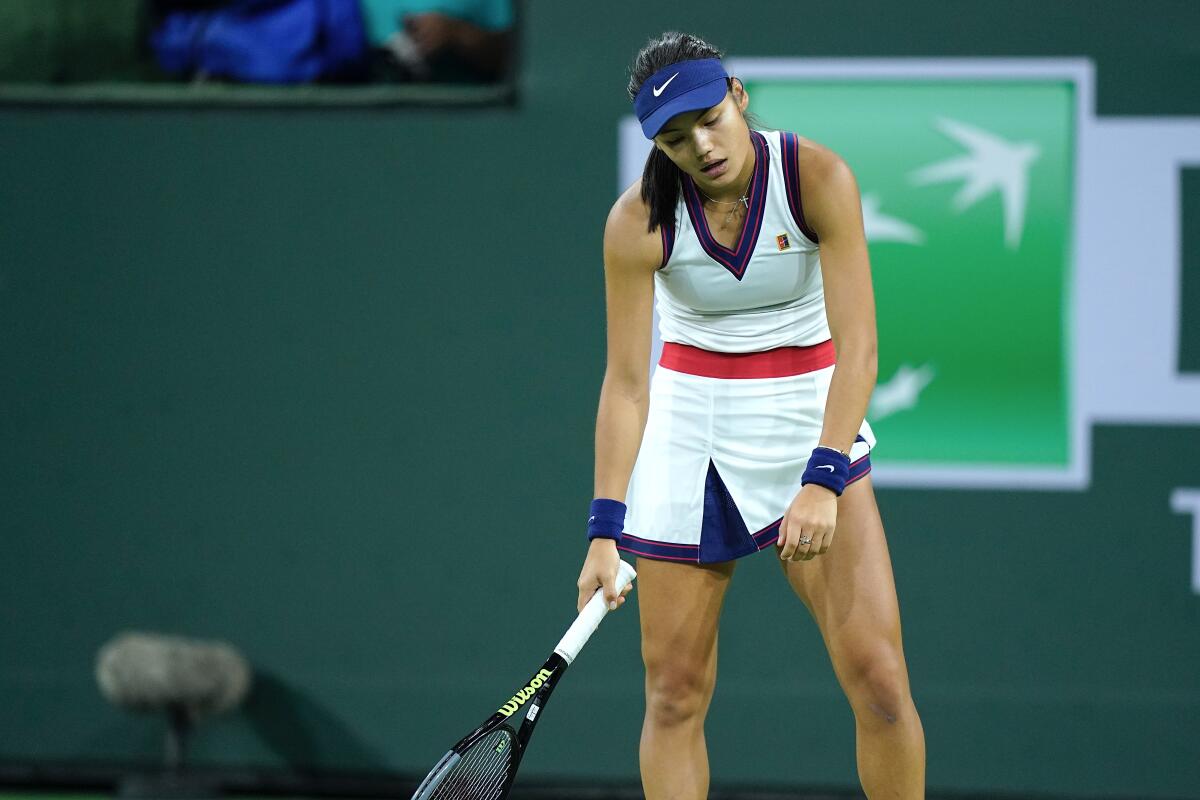 Emma Raducanu reacts after losing a point to Aliaksandra Sasnovich at the BNP Paribas Open.