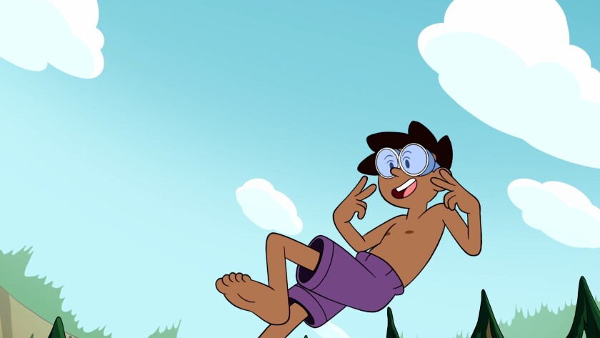 A smiling boy in mid-jump