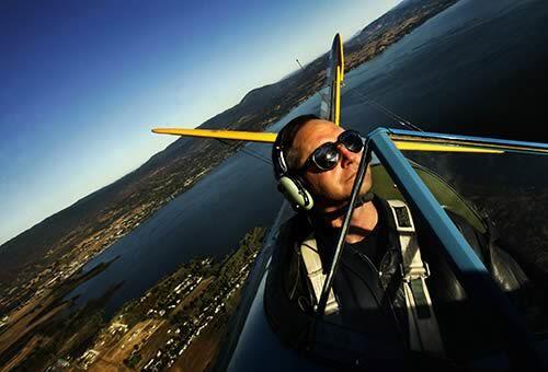 Herb Lingl with Lake County Biplane Tours of Lakeport, Calif., takes visitors on an aerial spin above lakes and landscapes in the Northern California area.