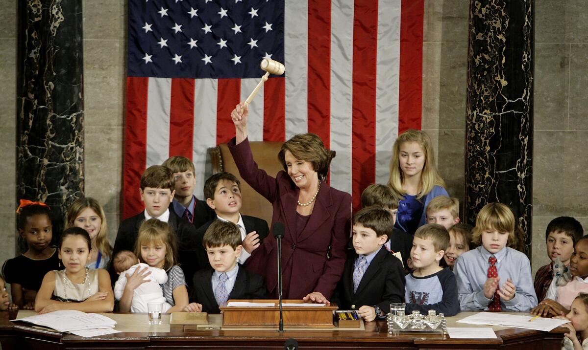 Nancy Pelosi waves the speaker's gavel