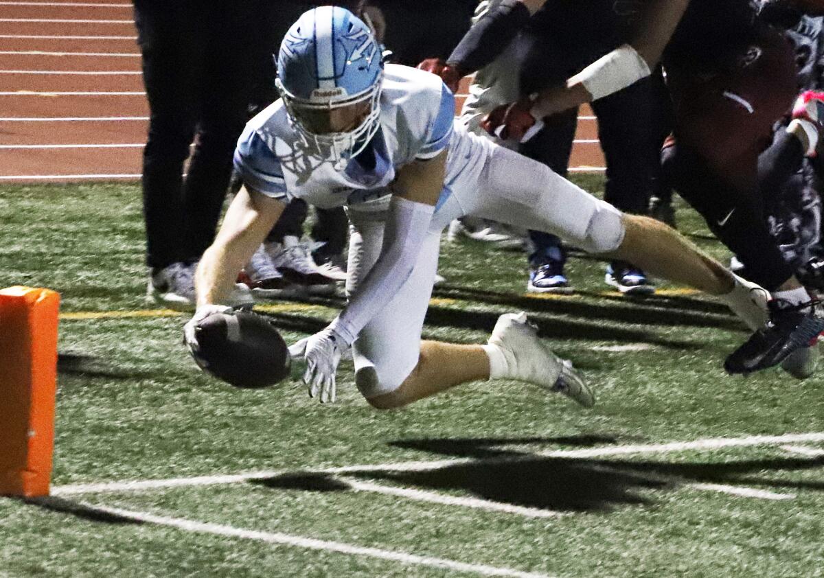 Corona del Mar's Breck Clemmer (88) dives towards the goal line against La Serna on Friday night at California High.
