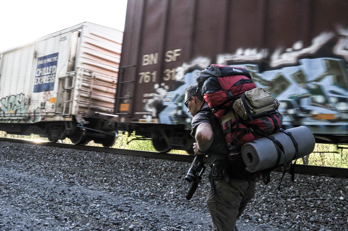 Sebastian Junger heading west along the Juniata River somewhere west of Duncannon, PA. 2013. 