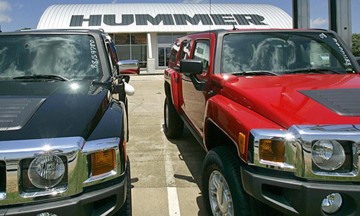 New General Motors Hummer SUVs sit on a dealer lot in Benton, Ark.