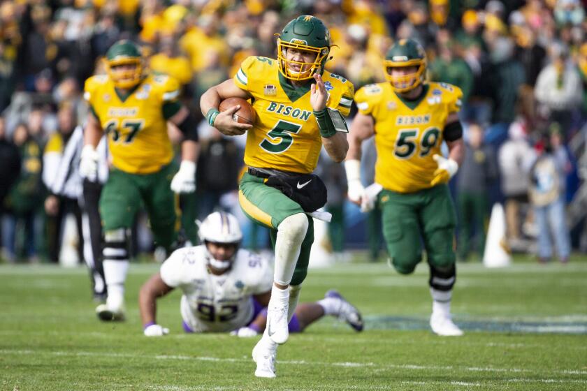 North Dakota State quarterback Trey Lance (5) runs with the ball during the second half of the FCS championship NCAA college football game against James Madison, Saturday, Jan. 11, 2020, in Frisco, Texas. (AP Photo/Sam Hodde)