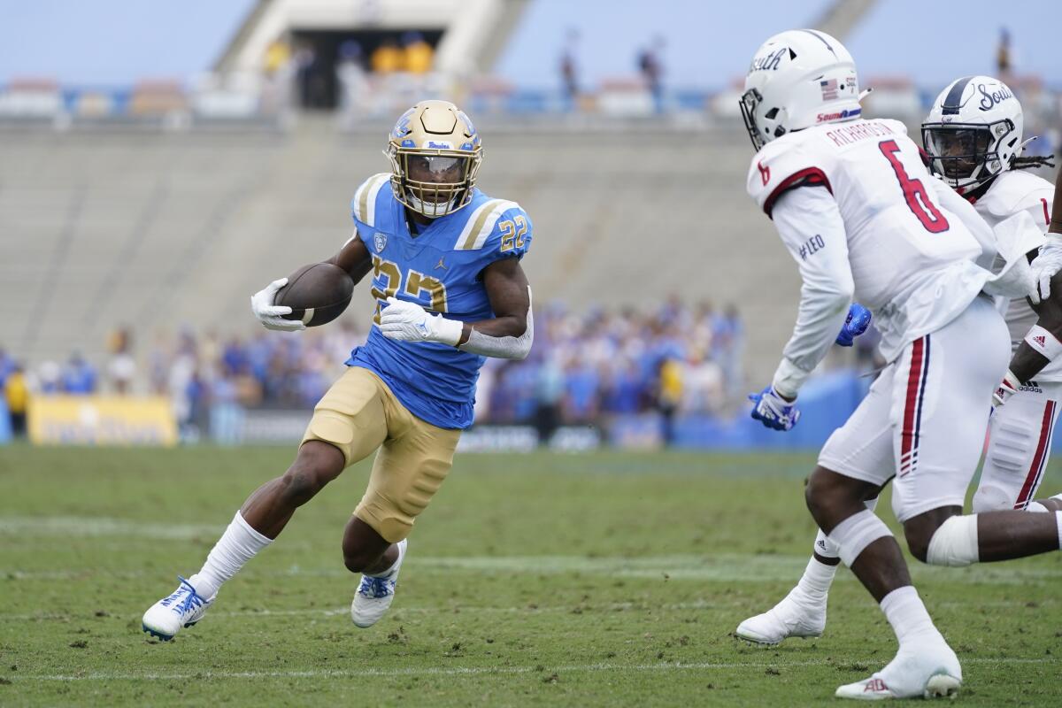 UCLA's Keegan Jones runs the ball against South Alabama on Saturday at the Rose Bowl. 