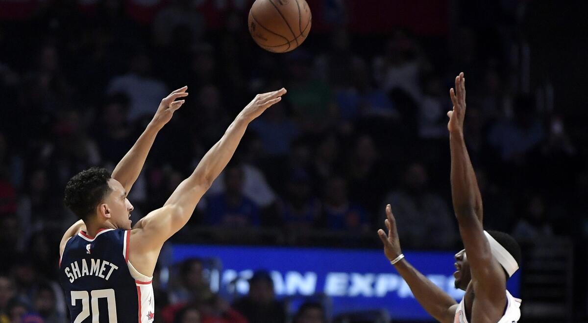 Landry Shamet makes one of his three-pointers Sunday.