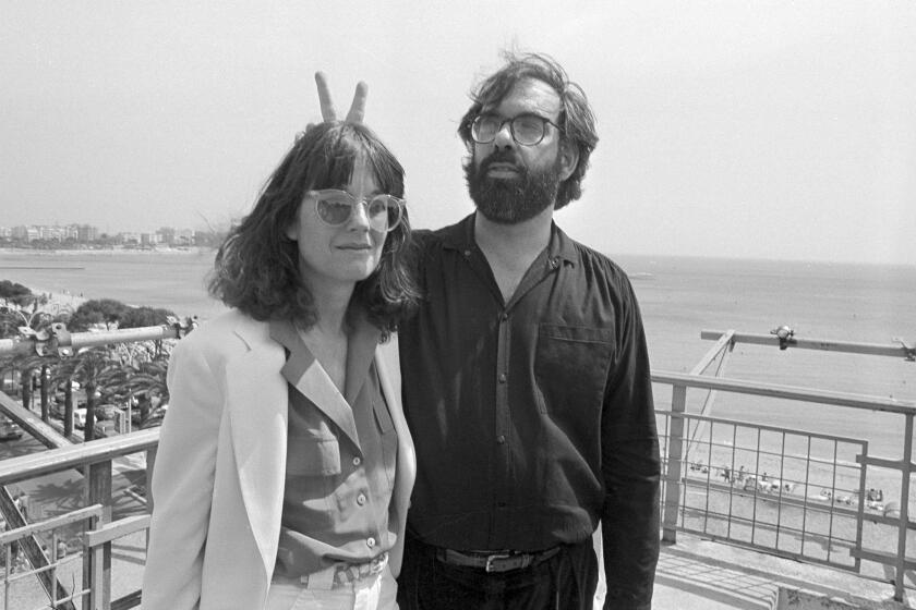 FILE - Film director Francis Ford Coppola appears with his wife Ellie at the Cannes Film Festival on May 19, 1979. Coppola is back at Cannes with his latest film "Megalopolis." (AP Photo, File)