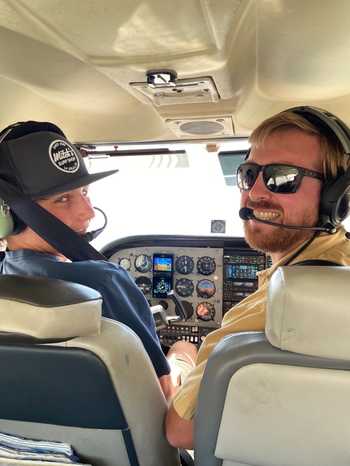 Charlie Lansky takes the helm with flight instructor Zac Triplett.