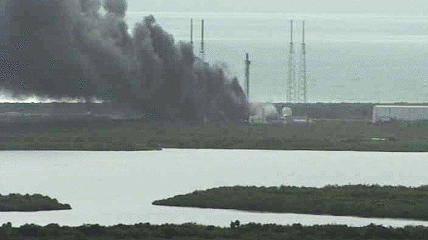 NASA live camera shows fire burning on a launch pad after a SpaceX Falcon 9 rocket exploded during a test firing in Cape Canaveral, Fla.