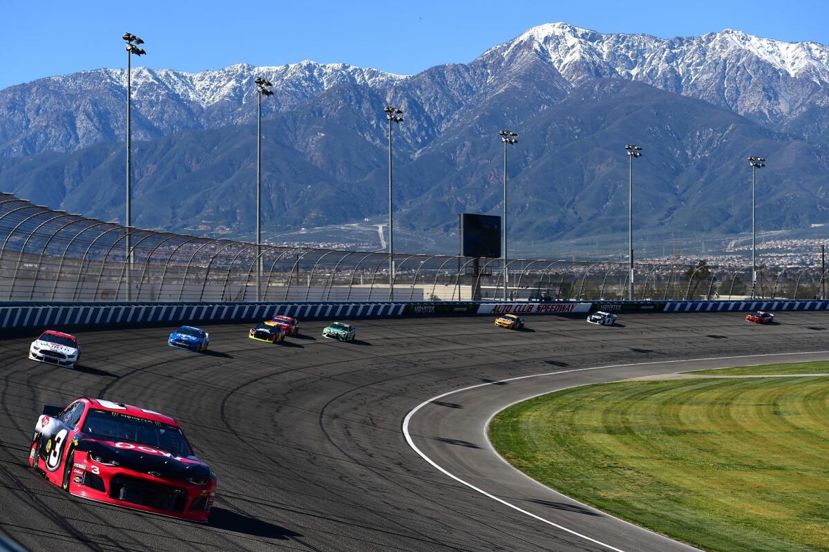 Cars circle the track March 15 during qualifying for the Auto Club 400 in Fontana.