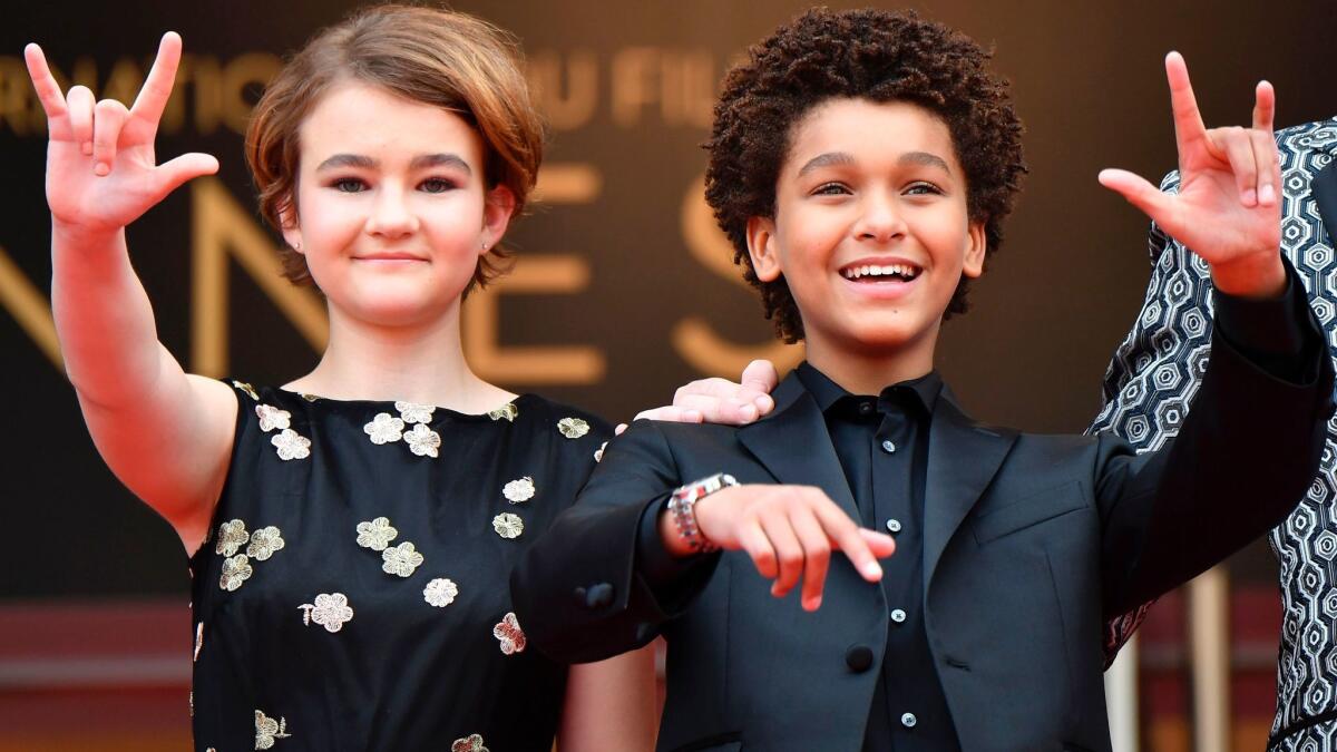 Millicent Simmonds, left, and Jaden Michael arrive for the screening of their film "Wonderstruck" at the Cannes Film Festival.