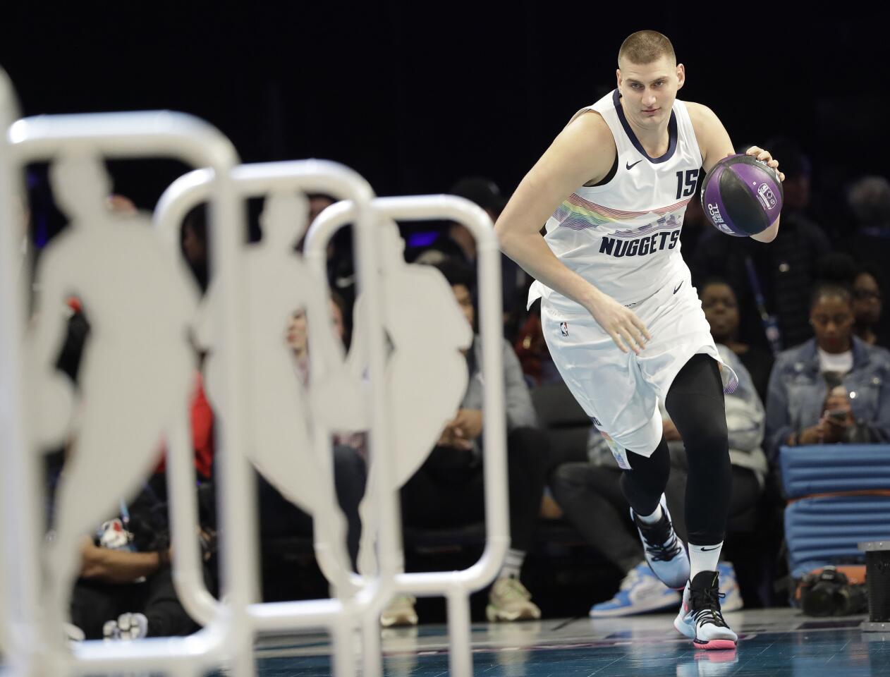 Nuggets center Nikola Jokic approaches the obstacle portion of the skills competition course.