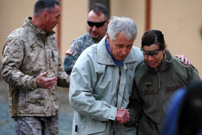 U.S. Secretary of Defense Chuck Hagel is greeted by military personnel after arriving at International Security Assistance Force headquarters in Kabul, Afghanistan.