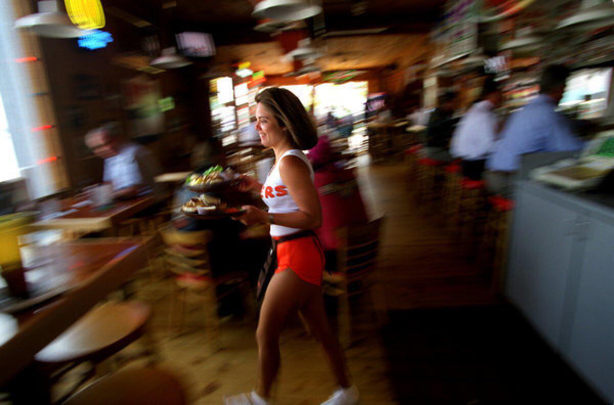 Hooters has said it will pick up the tab for an Oregon middle school football team's party.