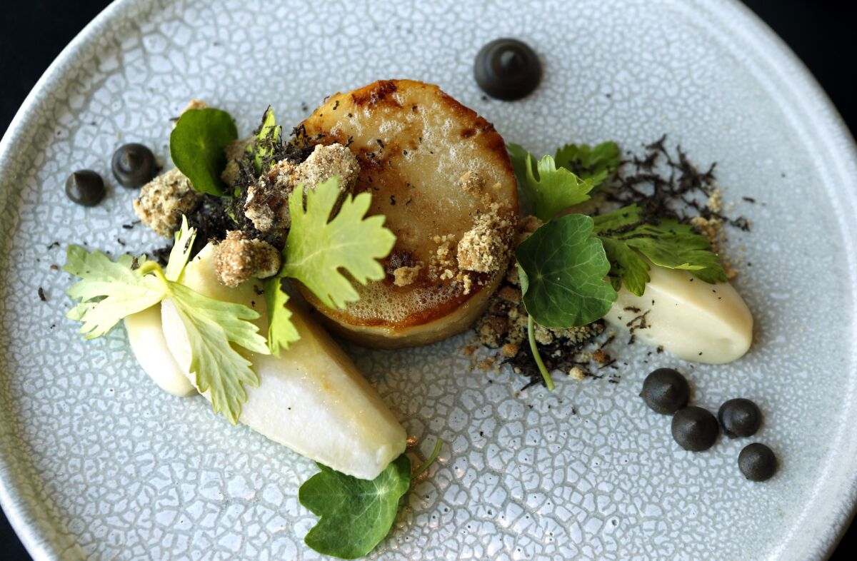On the plate at 71Above: celery root, pear, black truffle, lovage and black walnut crumble.