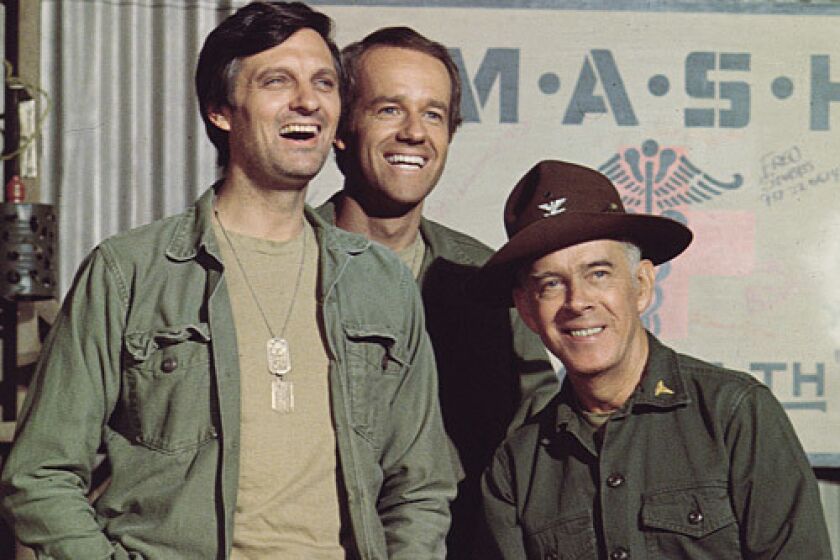 Harry Morgan right, with "MASH" costars Alan Alda and Mike Farrell.