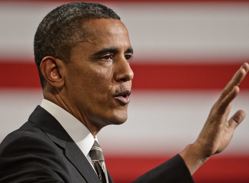 President Obama speaks at Hyde Park Academy in Chicago, Ill. Obama is calling for a raise to the federal minimum wage.
