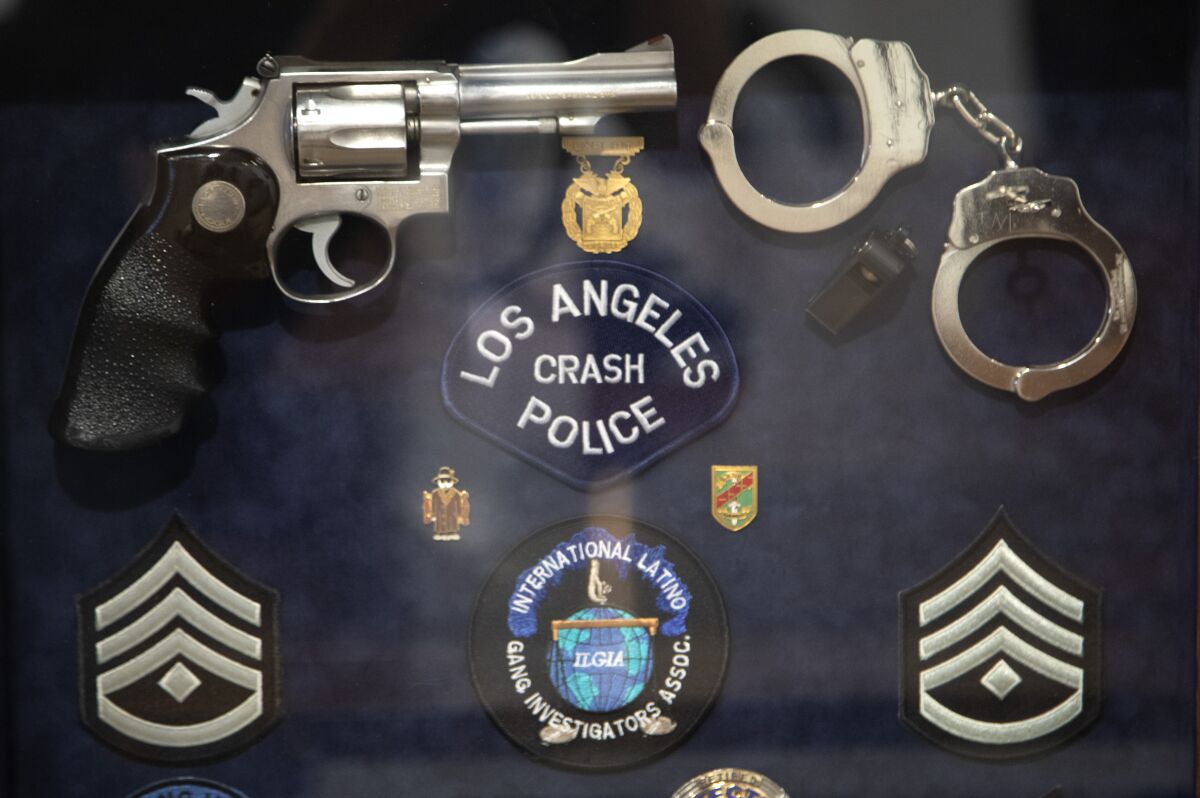 Among the items are memorabilia from a gang enforcement officer.