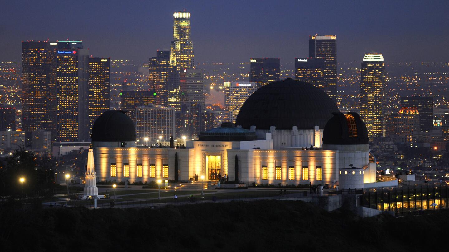 A view of Griffith Observatory with downtown Los Angeles in the background. It marks 80 years May 14 with three public events.