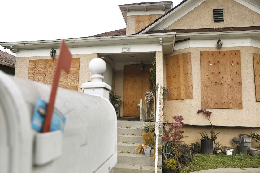 LOS ANGELES-CA-FEBRUARY 20, 2023: A home remains boarded up on 27th street in Los Angeles where the fireworks explosion took place, on Tuesday, February 20, 2023. (Christina House / Los Angeles Times)