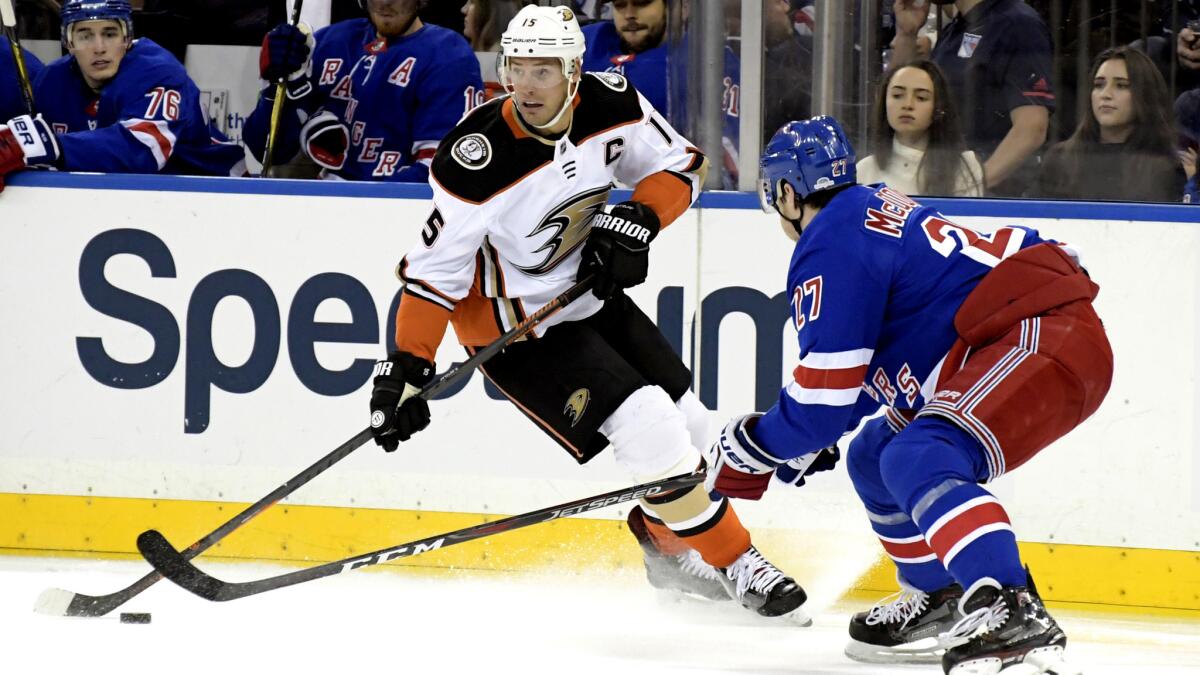 Ducks center Ryan Getzlaf looks to pass while under pressure from Rangers defenseman Ryan McDonagh during a game earlier this season.