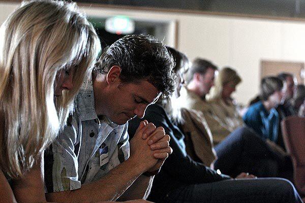 James and Melissa Shanahan attend Sunday services at the temporary home of Malibu Presbyterian Church. A brush fire destroyed the church's buildings in 2007.