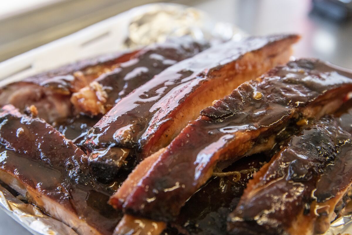 A slab of ribs is cut and ready to go at RibTown BBQ.