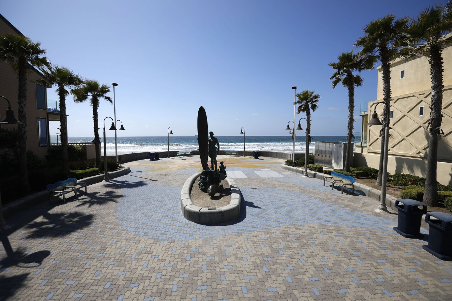 The Spirit of Imperial Beach Statue stands alone during a shutdown of beaches due to the coronavirus on March 29, 2020.
