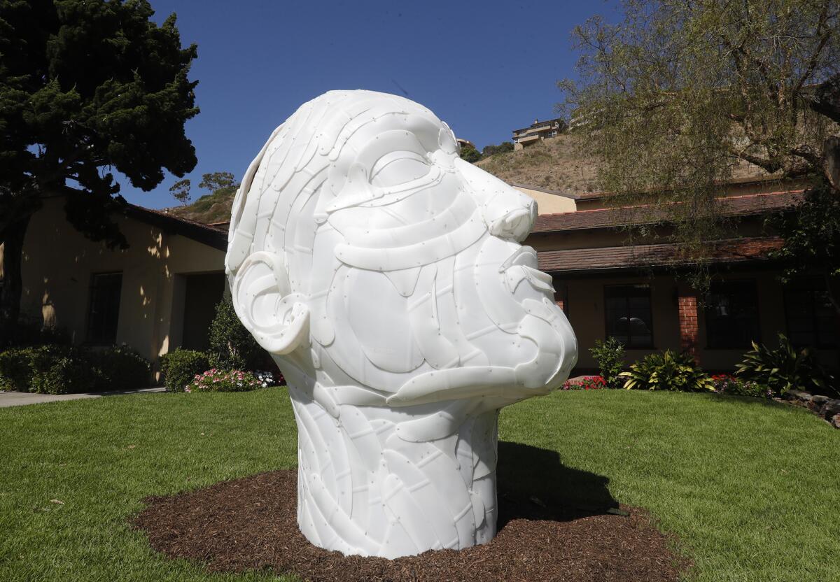 The sculpture of a human head, "Inquire Within," by artists Joel Stockdill and Yustina Salnikova.