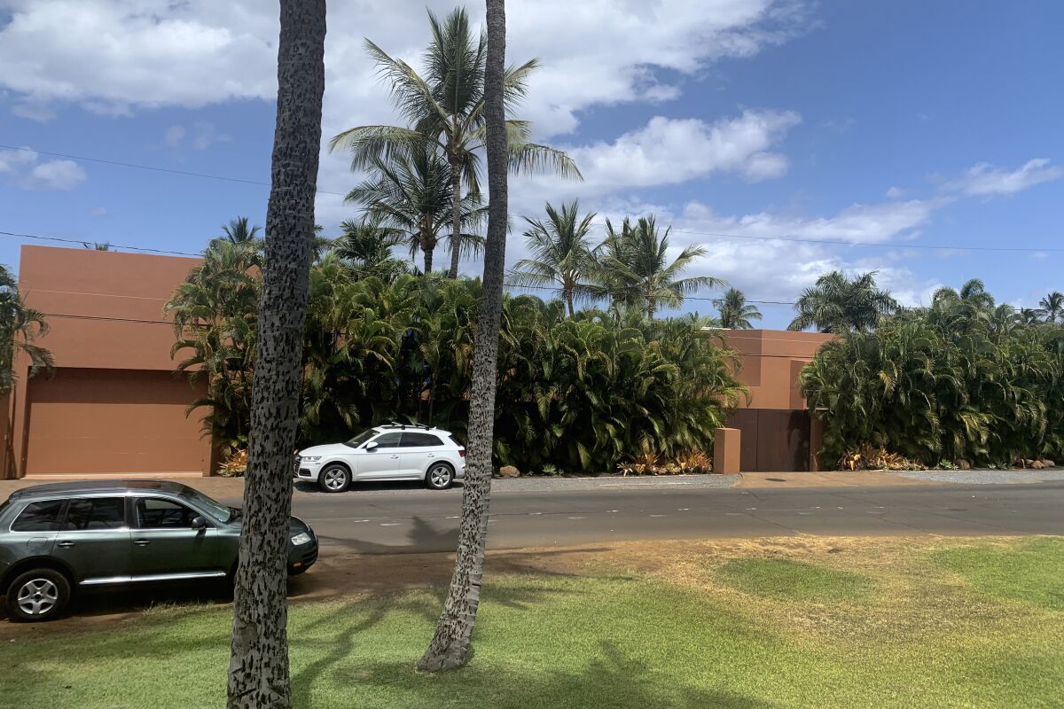 Part of a Maui mansion is seen from a street in Kihei, Hawaii on Thursday, Aug. 5, 2021. The $45-million cash sale of the eight-bedroom house reflects a hot real estate market where the median price of a Maui home topped $1.1 million in June. (J.D. Kim via AP)