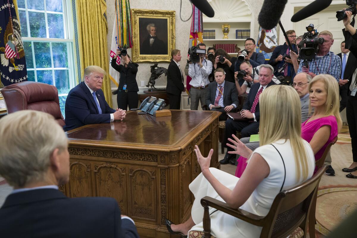 President Trump gets an update on the opioid crisis from his daughter Ivanka in the Oval Office on June 25, 2019.