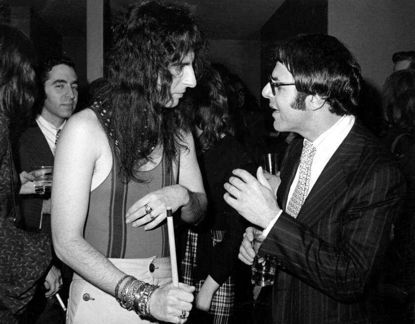 Shock-rock star Alice Cooper with record executive Joe Smith in the 1970s.