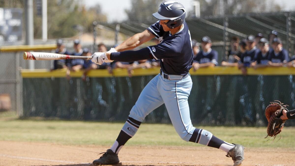 Corona del Mar High's Chazz Martinez singles during the first inning of a Pacific Coast League game at Northwood on Tuesday.