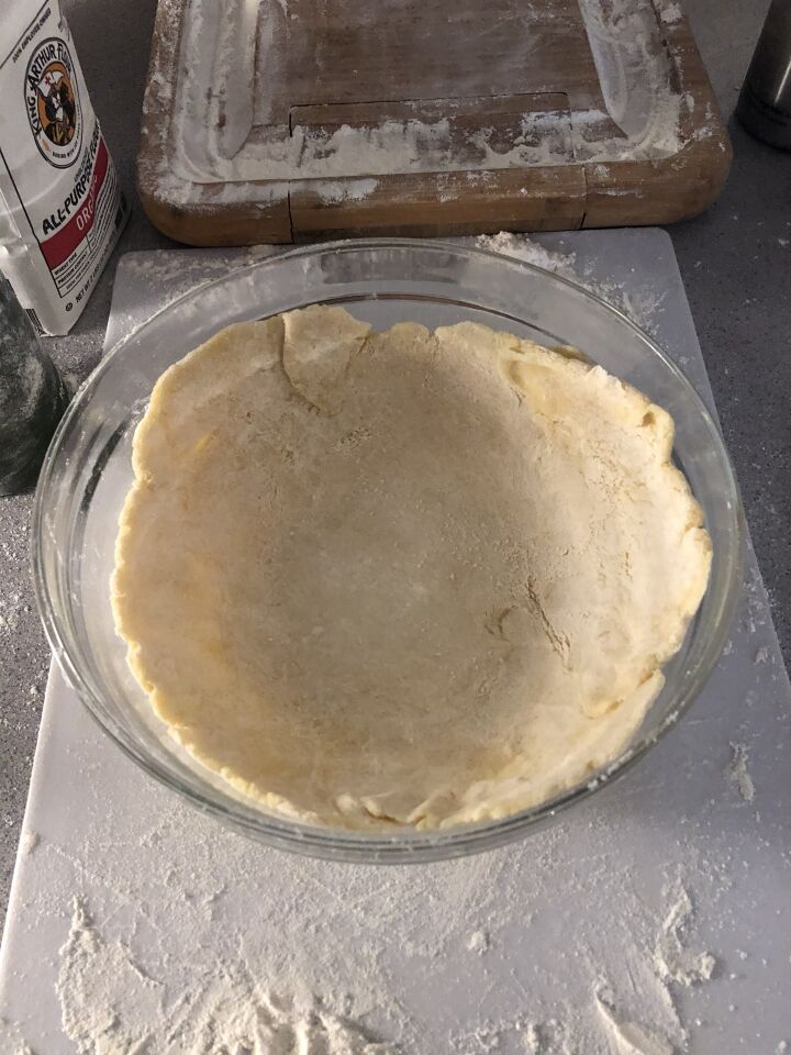 My pie crust in the bowl before folding the sides to form a traditional pie shape