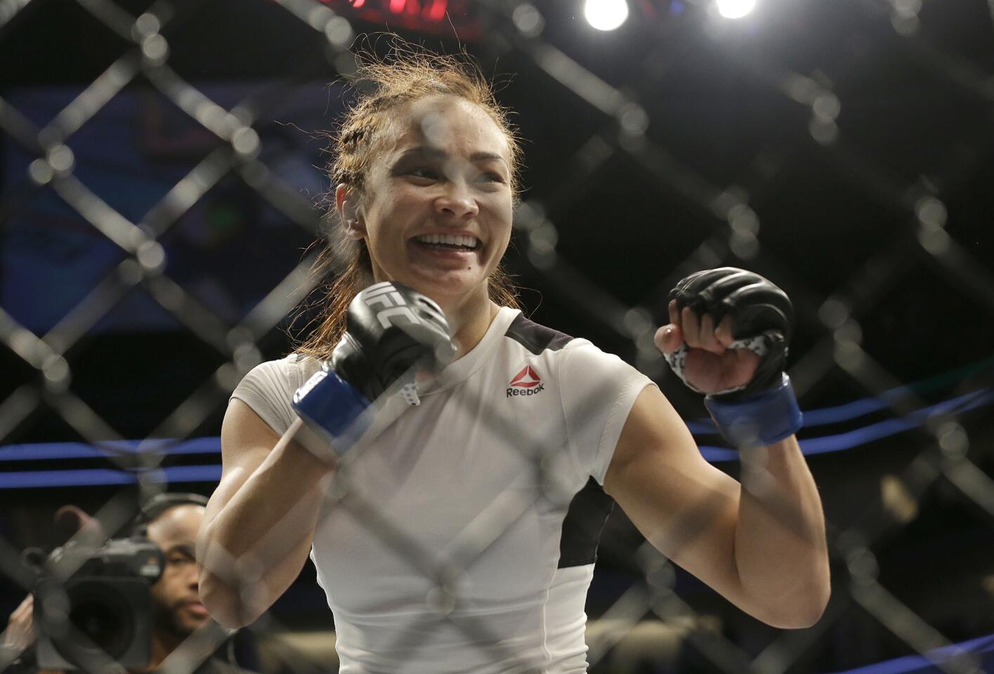Michelle Waterson celebrates after beating Paige VanZant in a UFC Fight Night mixed martial arts fight in Sacramento, Calif., Saturday, Dec. 17, 2016. Waterson won by submission in the first round. (AP Photo/Jeff Chiu)