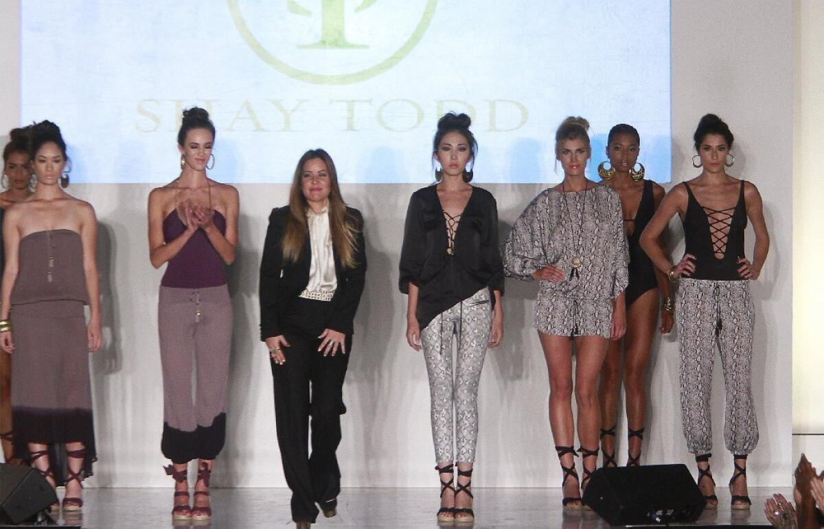Designer Shay Todd and models take a bow at Fashion Business Inc.'s "All Aboard" fundraiser.