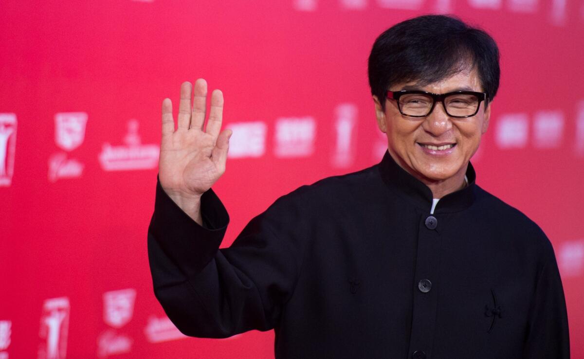 Jackie Chan poses on the red carpet during the opening ceremony of the Shanghai International Film Festival in Shanghai on June 13, 2015.