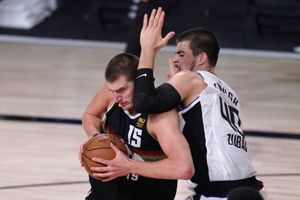 Denver Nuggets' Nikola Jokic tries to get past Clippers' Ivica Zubac.