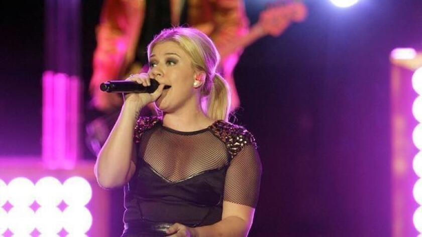 Kelly Clarkson is shown performing in late 2013 at Sleep Train Amphitheater in Chula Vista. (/ John Gastaldo/U-T San Diego)