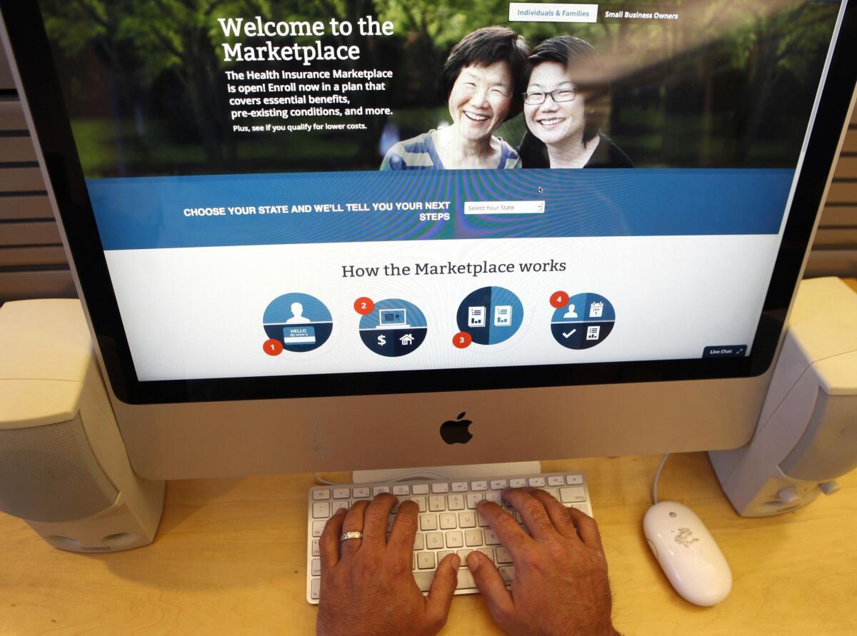 A man looks over the Affordable Care Act signup page on the HealthCare.gov website.