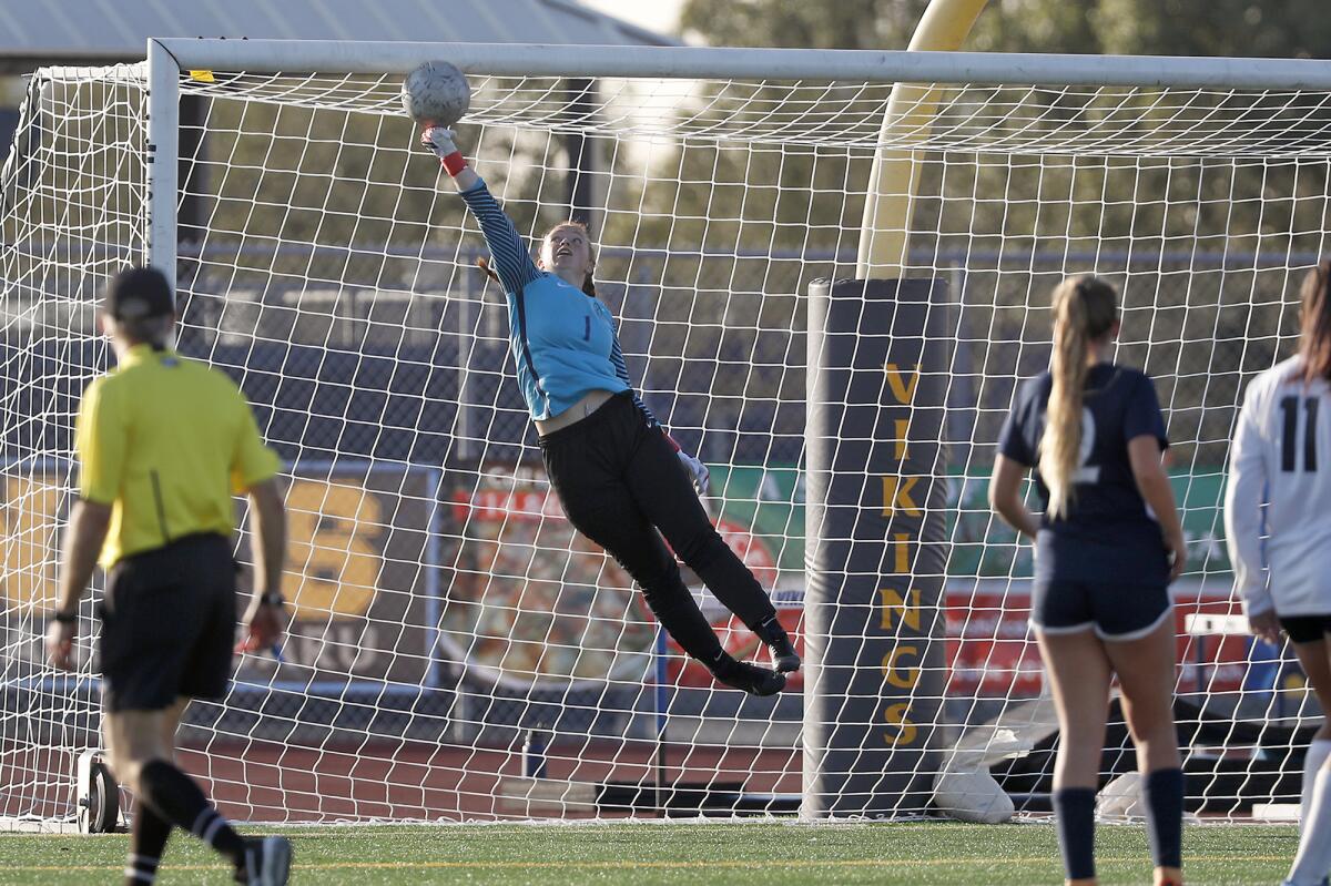 Marina goalkeeper Carly Miles (1) blocks the second-half shot against Capistrano Valley in the quarterfinals of the CIF Southern Section Division 2 playoffs on Wednesday.