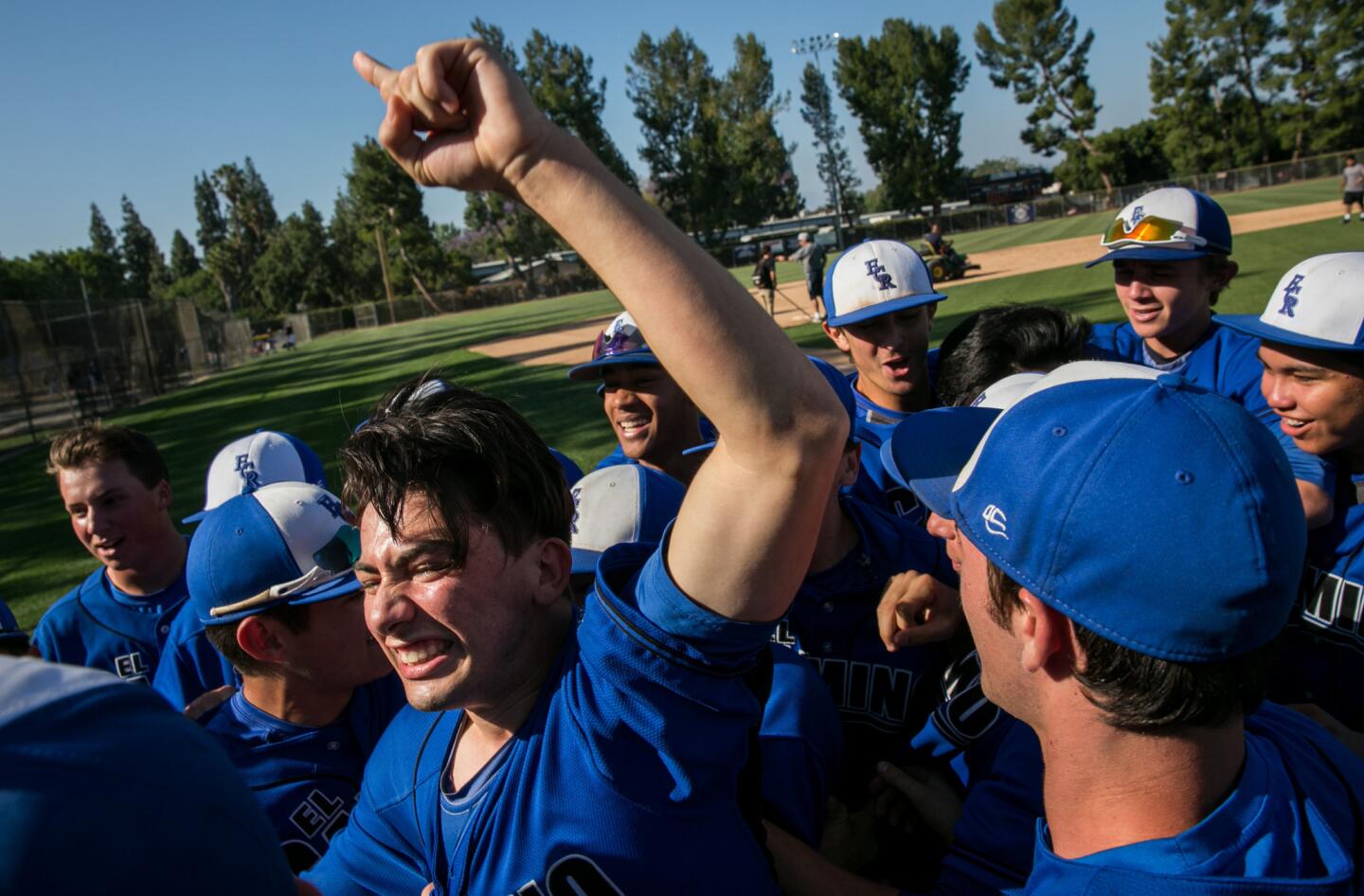 El Camino Real players celebrate their victory against Narbonne at Birmingham Charter High School in the City Section semifinals.