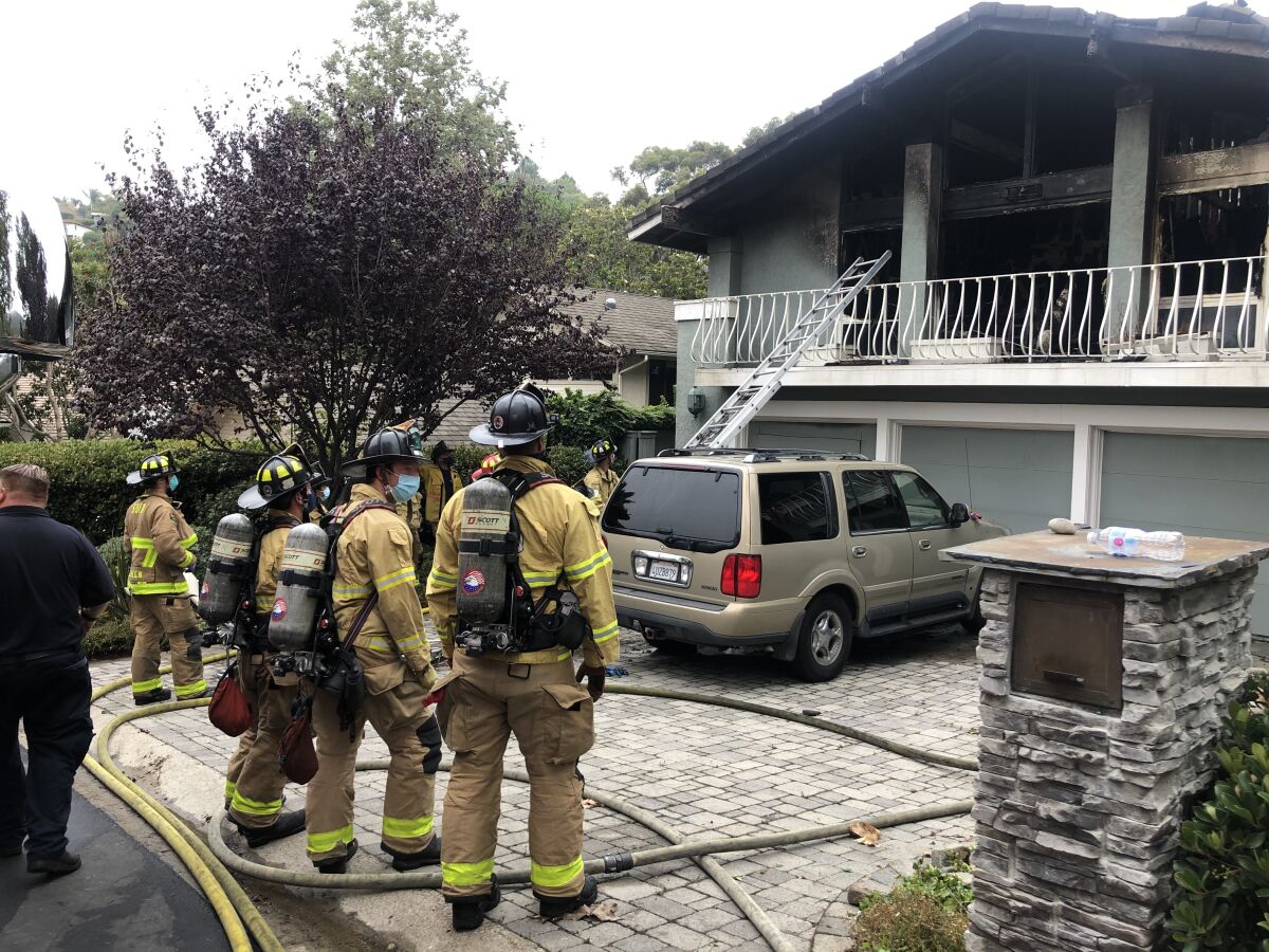 The bodies of two people were discovered inside a La Jolla home that caught fire early Monday morning.