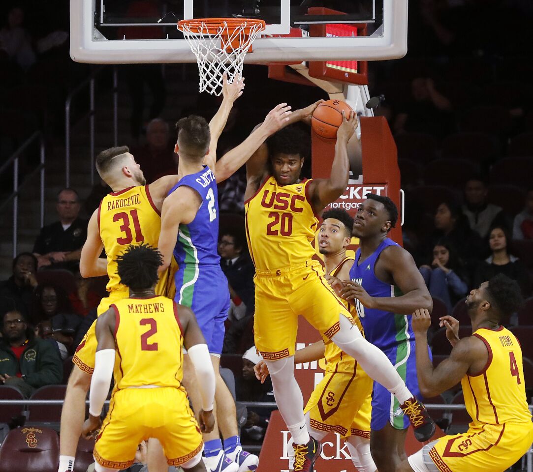 USC guard Ethan Anderson (20) pulls down a rebound during the second half against Florida Gulf Coast.