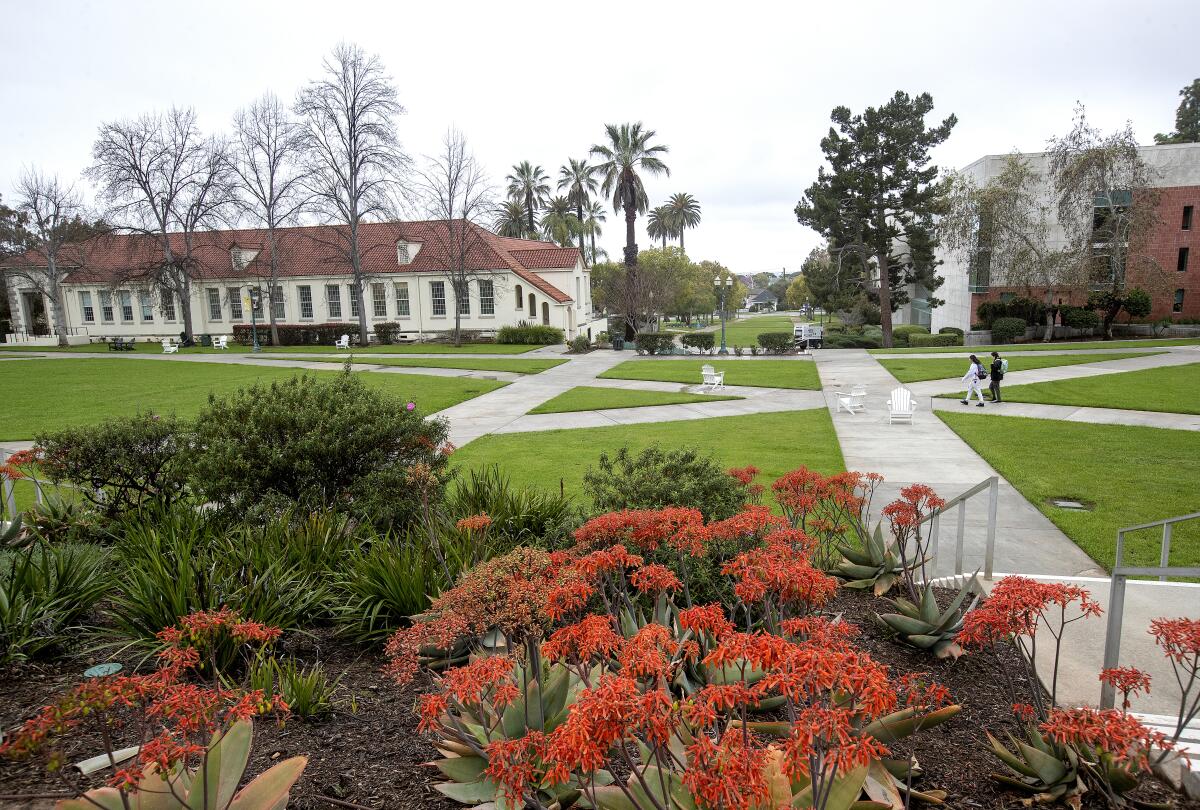 Students walk on the campus of Whittier College in March. Enrollment has plummeted at the college.