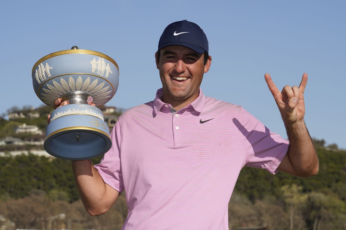 Scottie Scheffler holds the trophy after winning the Dell Technologies Match Play Championship.