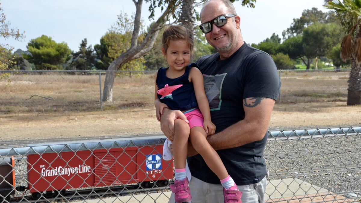 Derrick Fadden took his daughter, Kinsley, 3, for her first ride at Orange County Model Engineer train railroad.