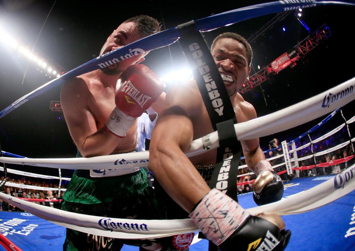 Shawn Porter, right, lands a punch against Paulie Malignaggi on April 19.