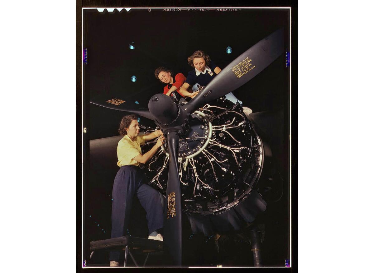 Female workers trained in precise aircraft engine installation duties at Douglas Aircraft Co. in Long Beach.